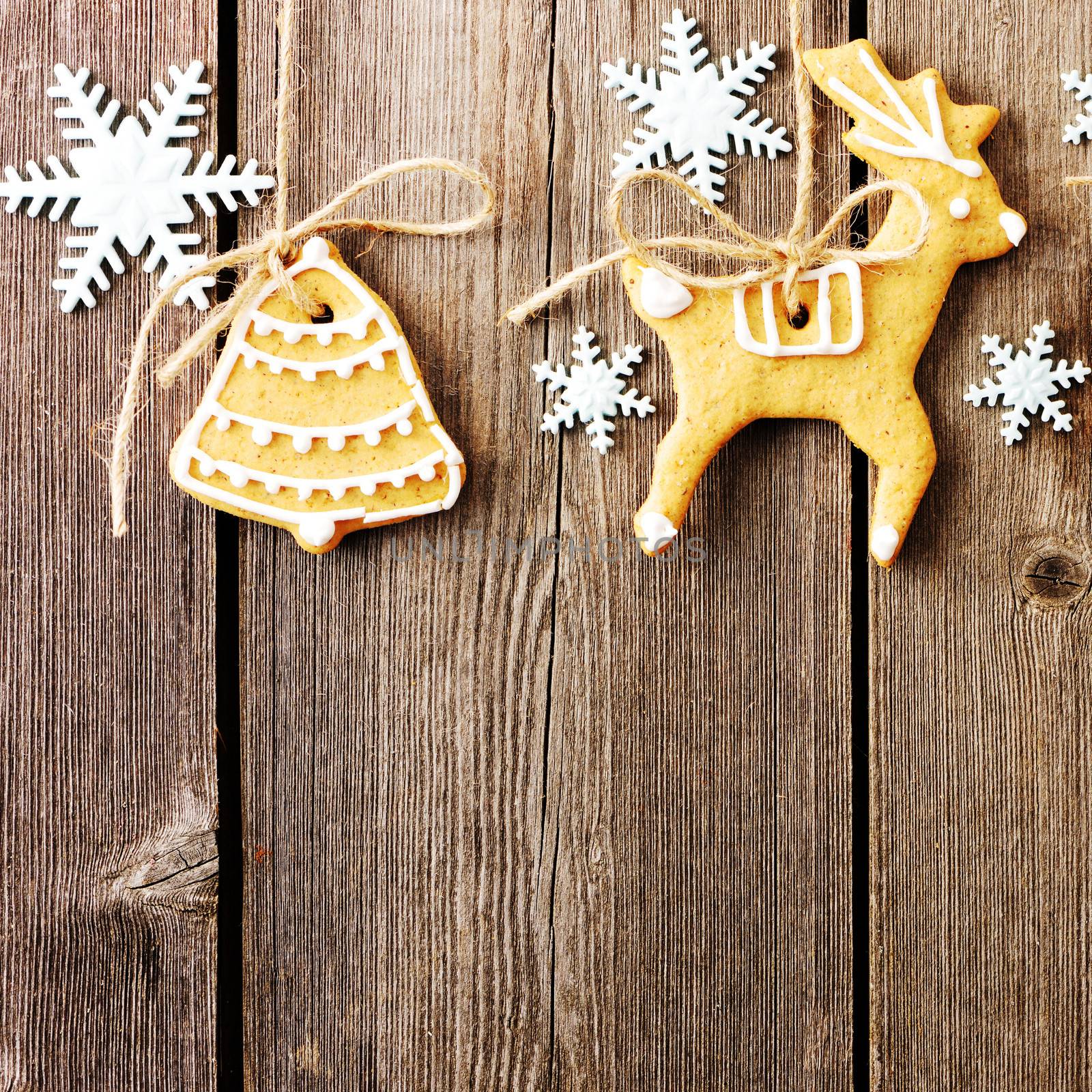 Christmas homemade gingerbread cookies over wooden table