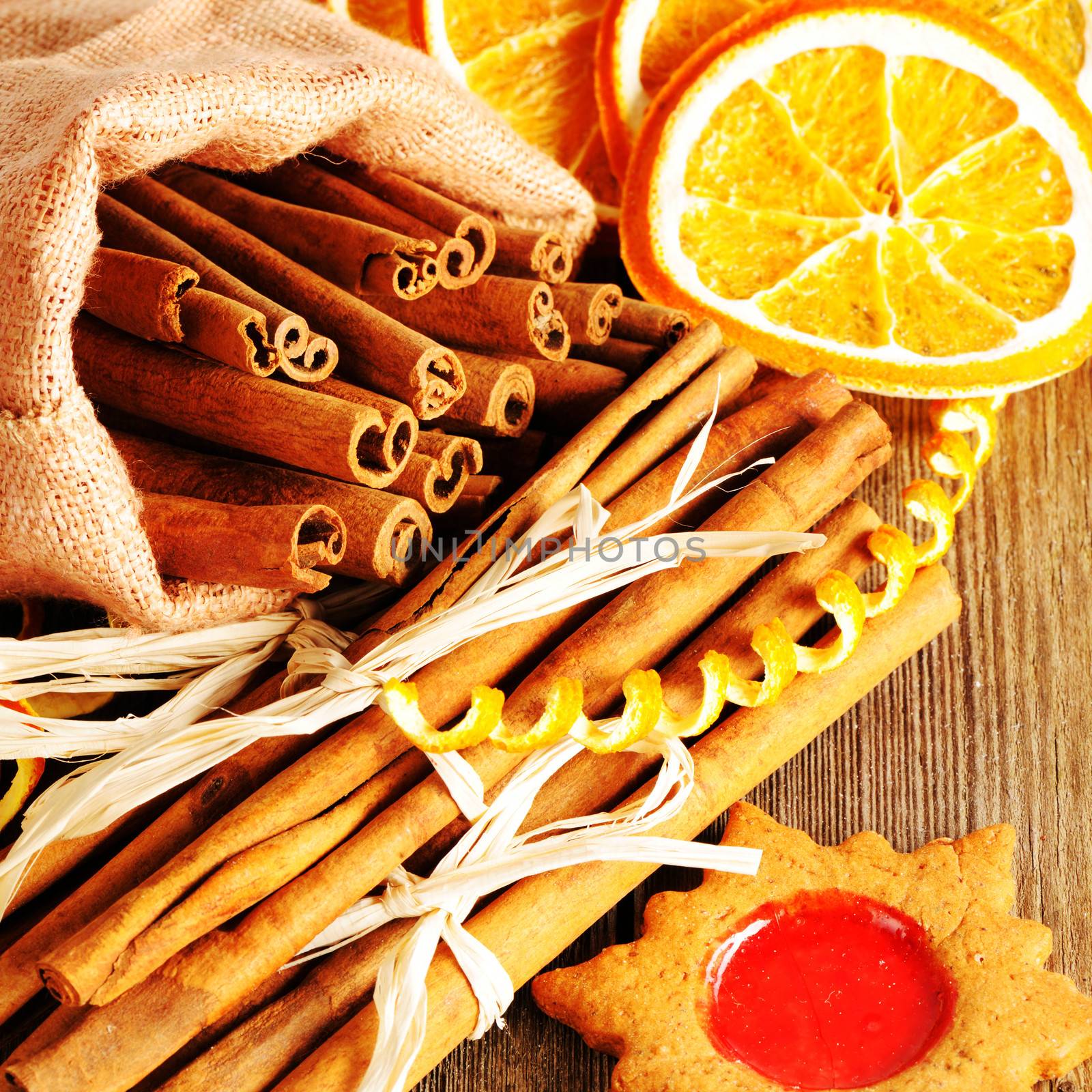 Christmas homemade gingerbread cookie and spices over wooden table