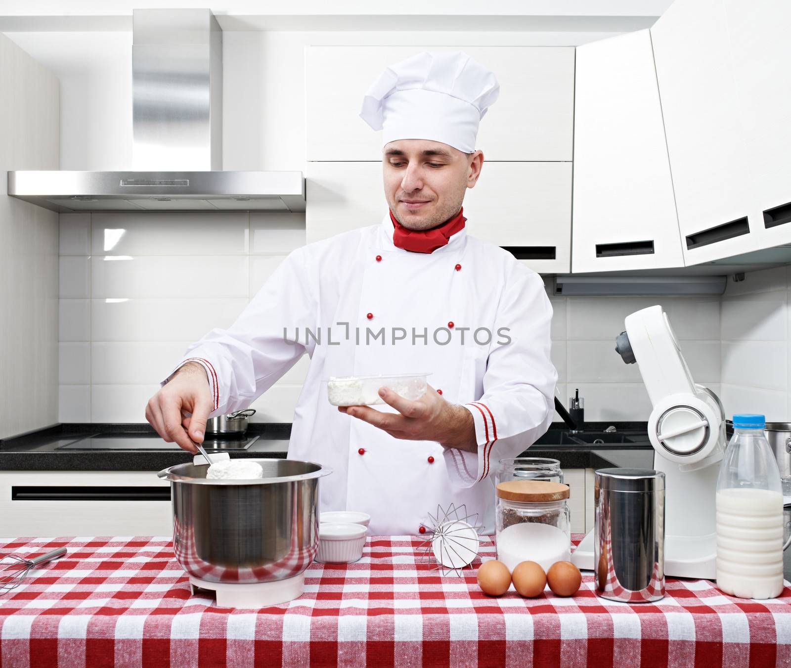 Male chef at kitchen getting ready to cook