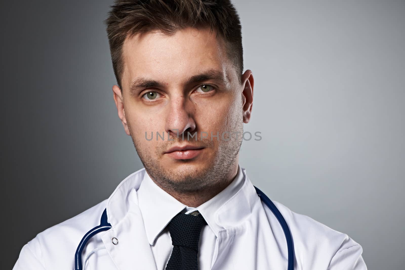 Medical doctor with stethoscope portrait by haveseen
