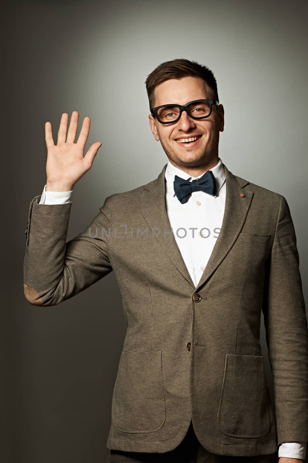 Nerd in eyeglasses and bow tie says Hello by haveseen