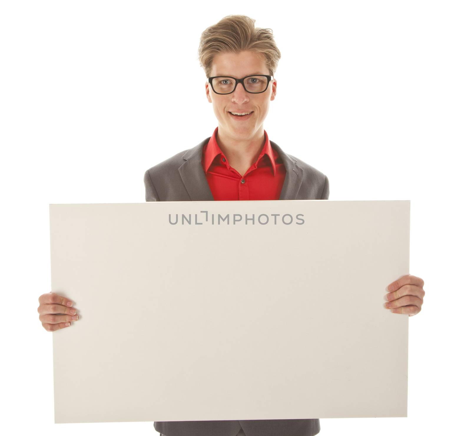 Young man holding a white board isolated on white background