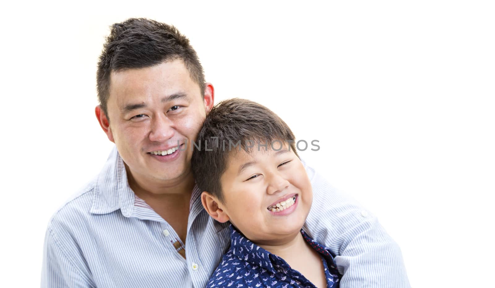 A father holding son for a portray shot on a isolated white background.