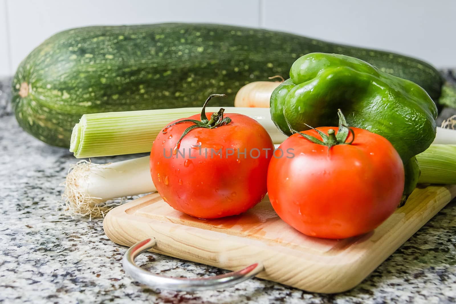 Fresh vegetables on cutting board in the kitchen by doble.d