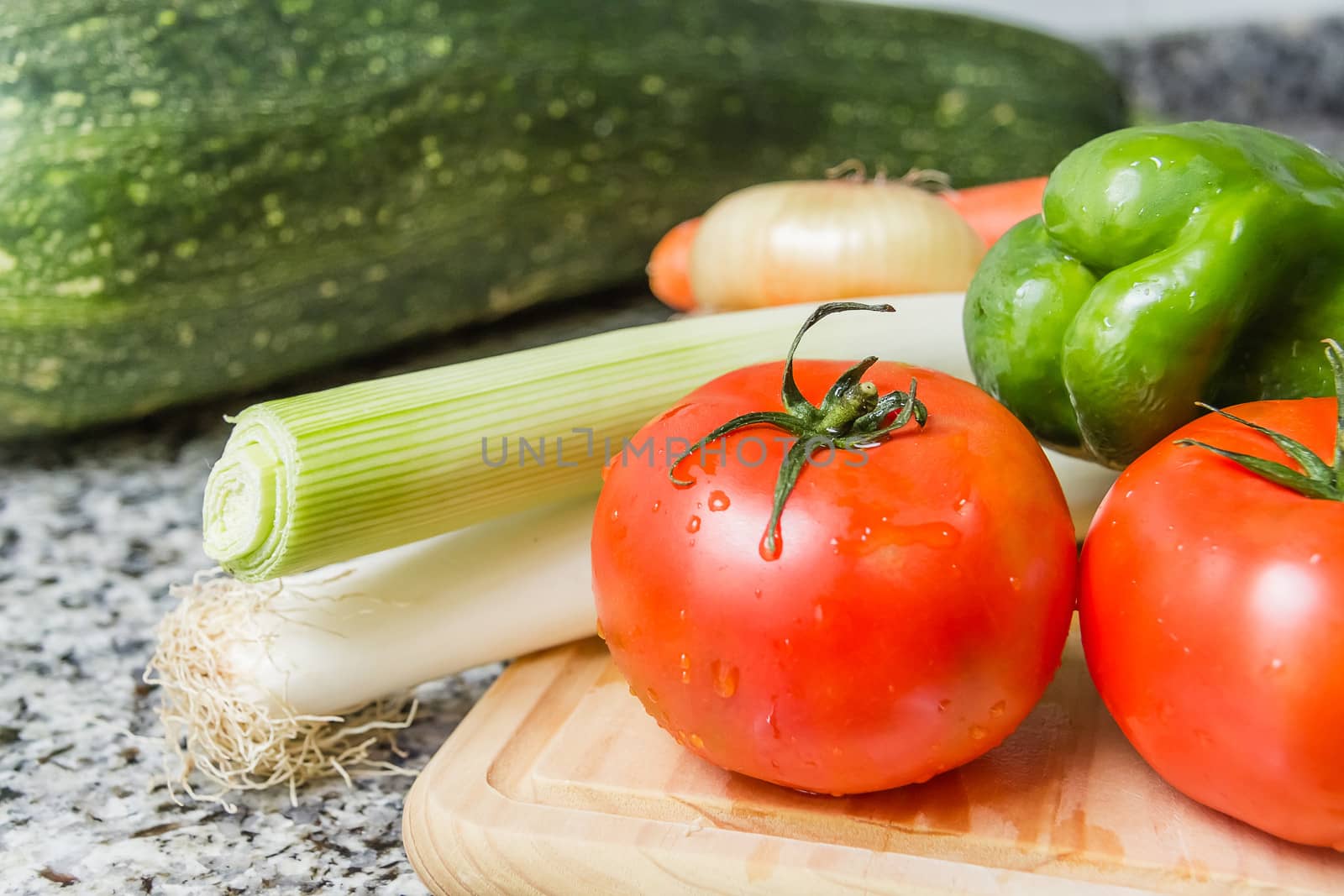 Fresh vegetables on cutting board in the kitchen by doble.d