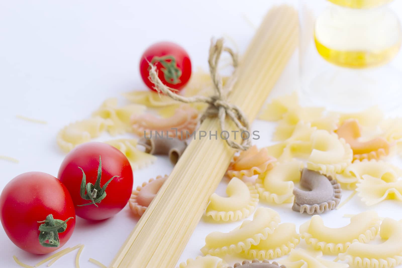 Multi-colored pasta isolated on a white background by victosha