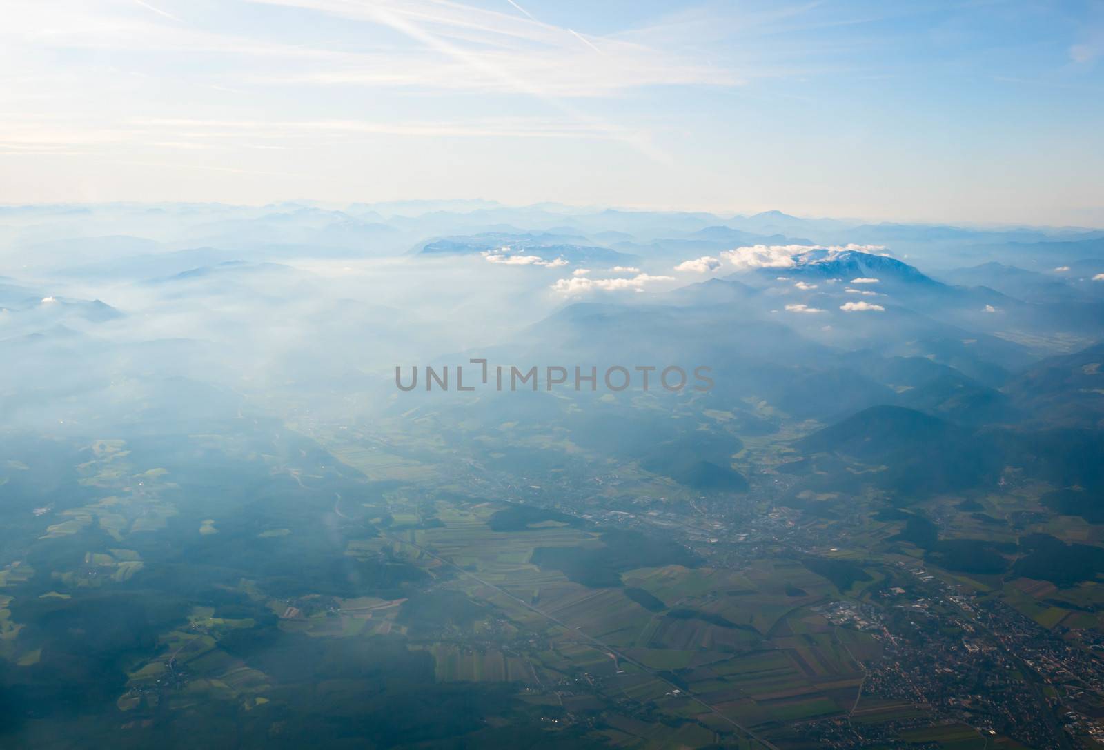 Aerial view of Alps above cloudscape and mountains