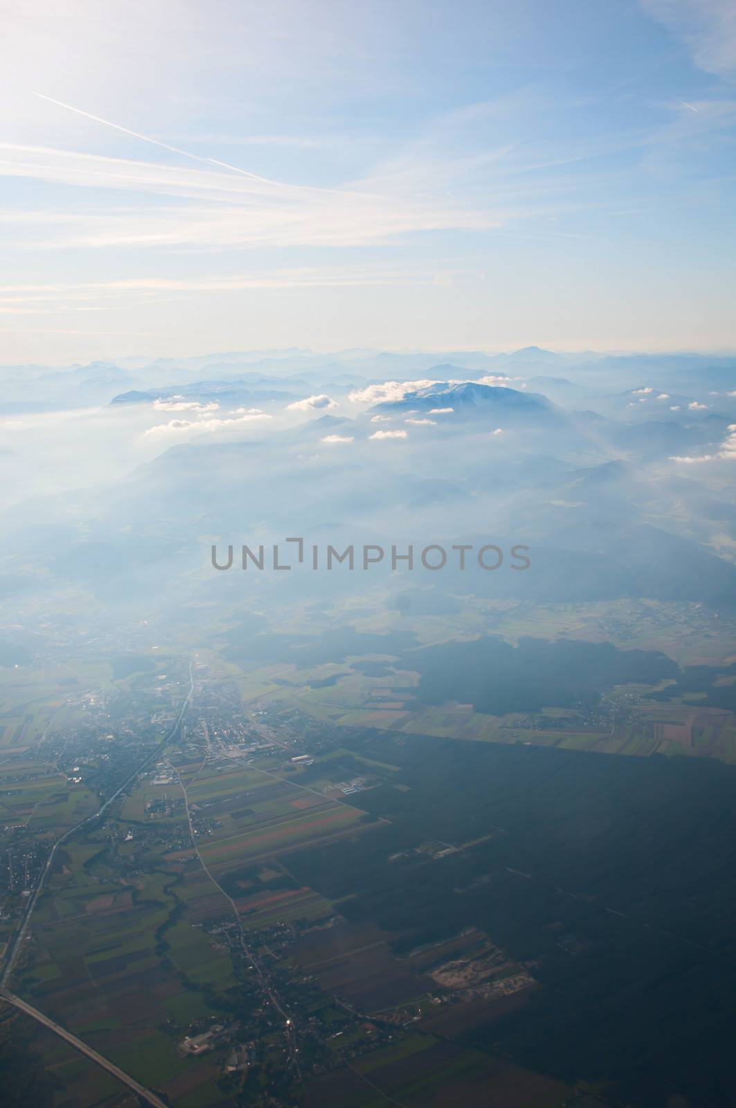 Aerial view of Alps above cloudscape and mountains