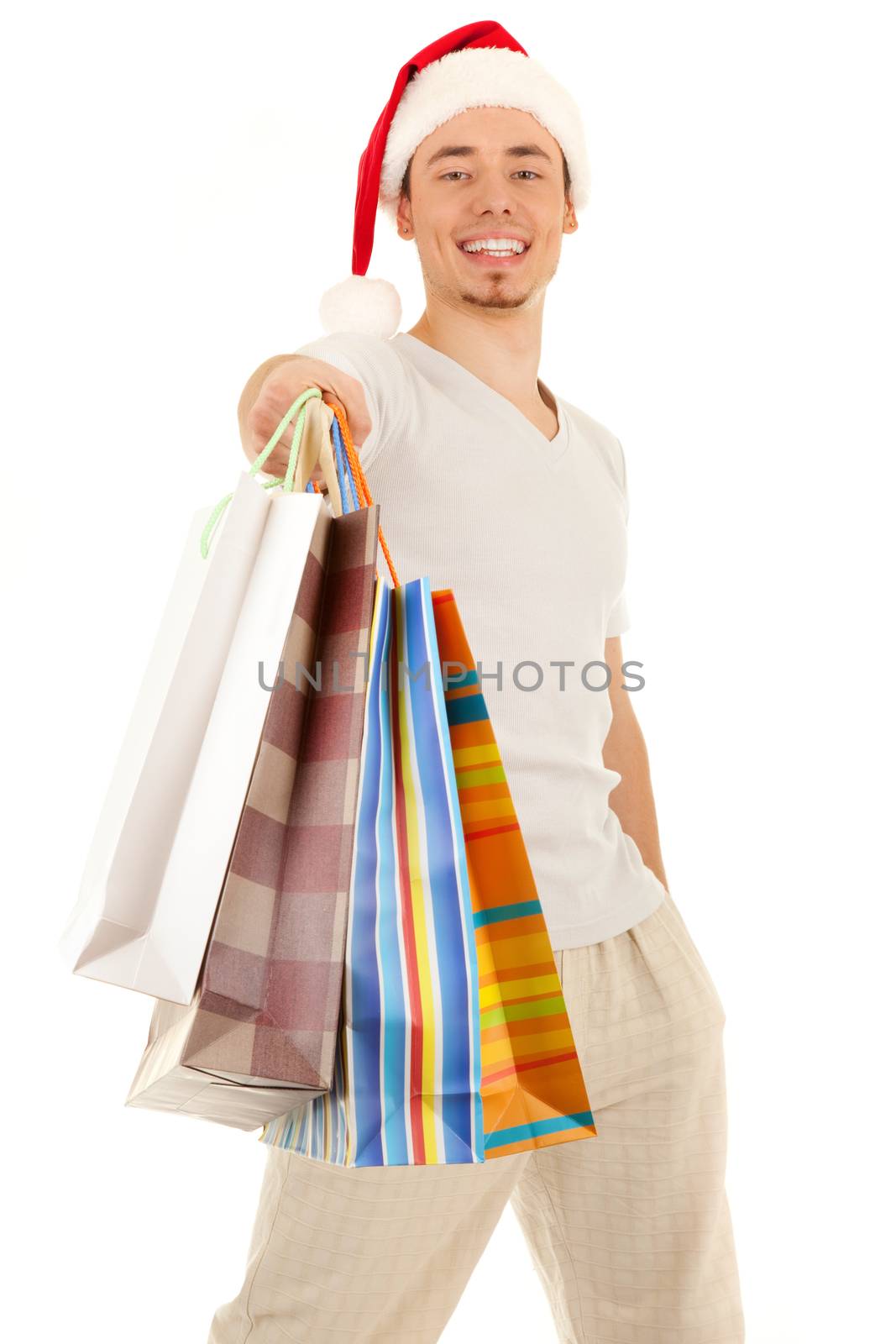 Young Santa with purchases in paper bags on white background