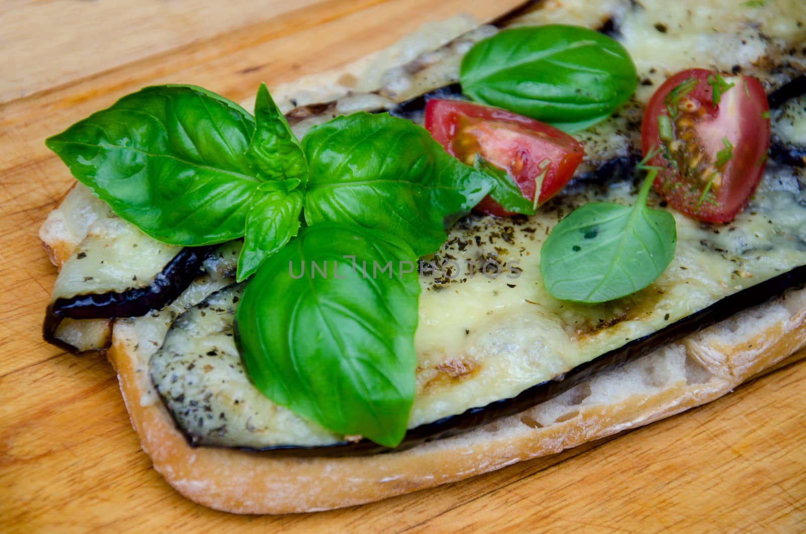 Italian pizza on a wooden board.