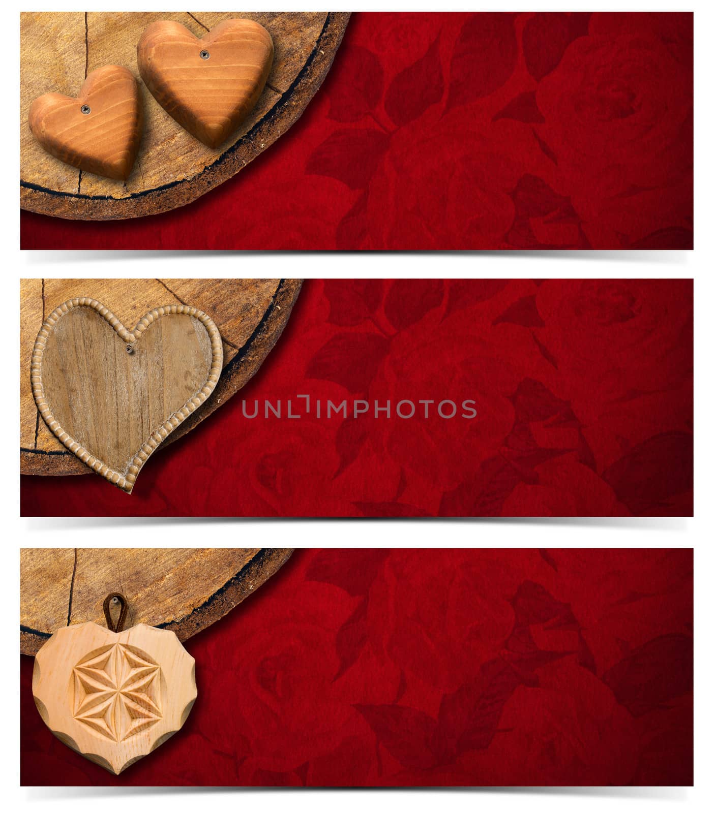 Handmade wooden hearts hanging from a section of tree trunk on red velvet background with roses flowers

