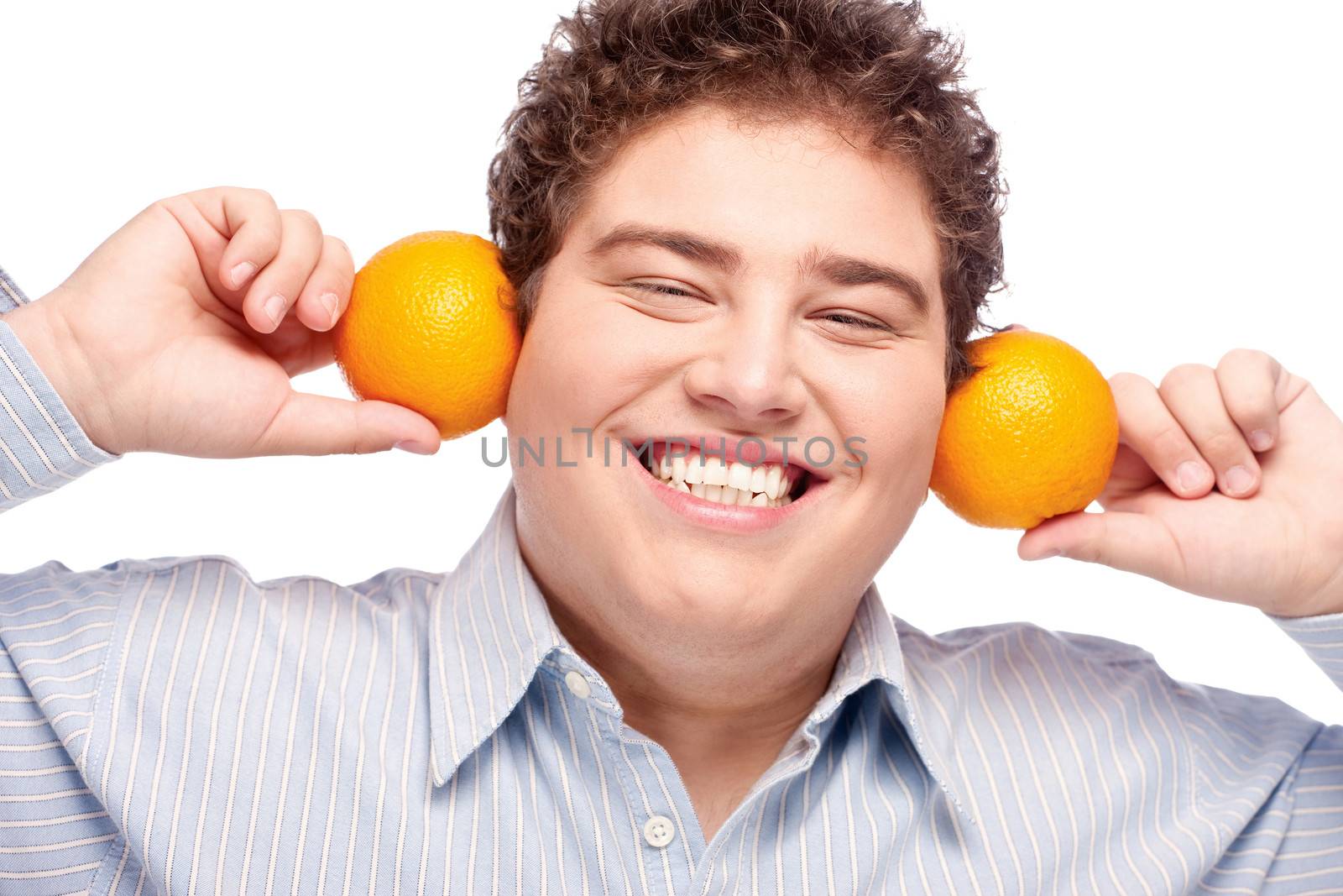 Happy chubby man with orange, isolated on white