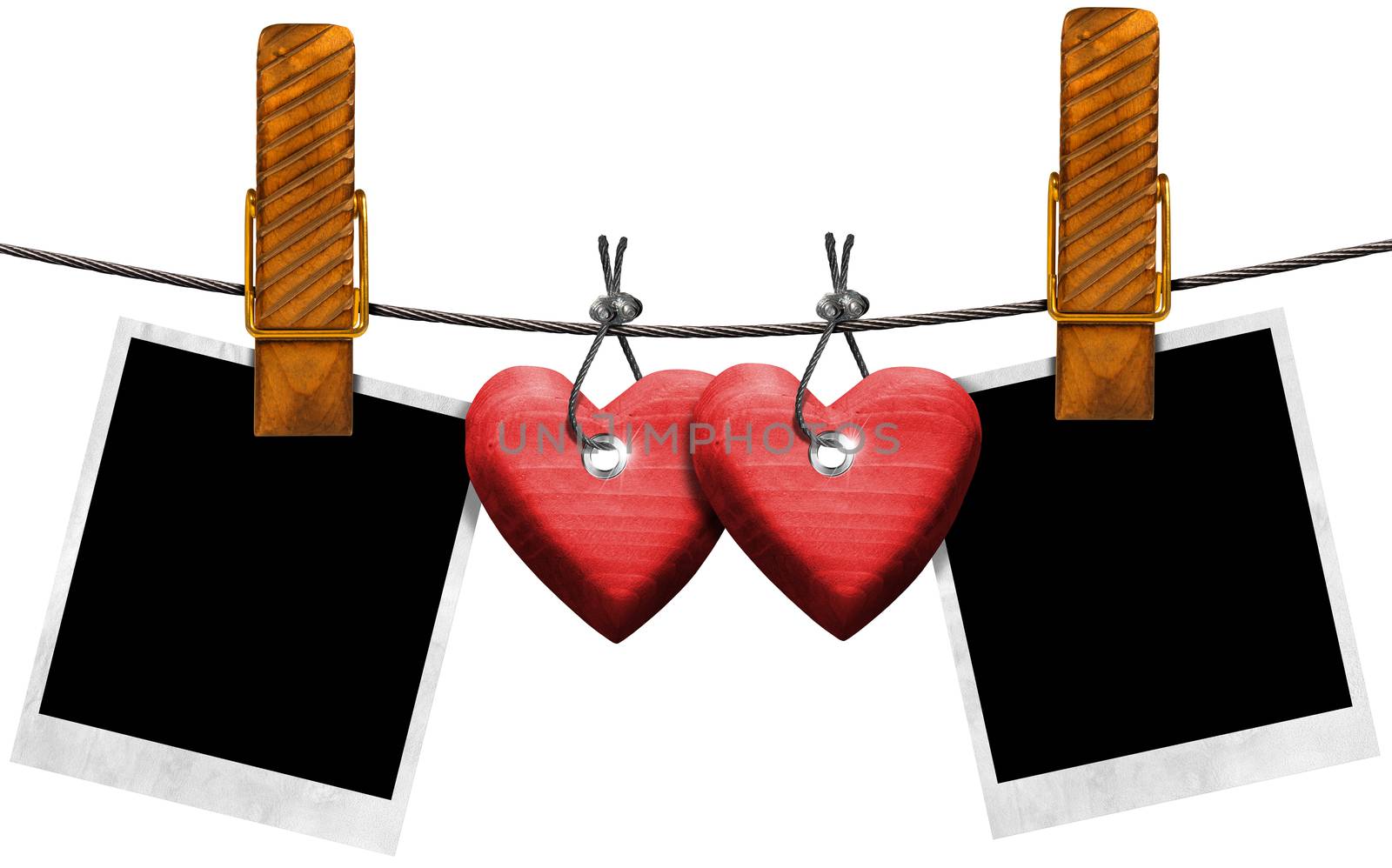 Two blank photos and two red wooden hearts hanging on a steel cable with large clothespin 


