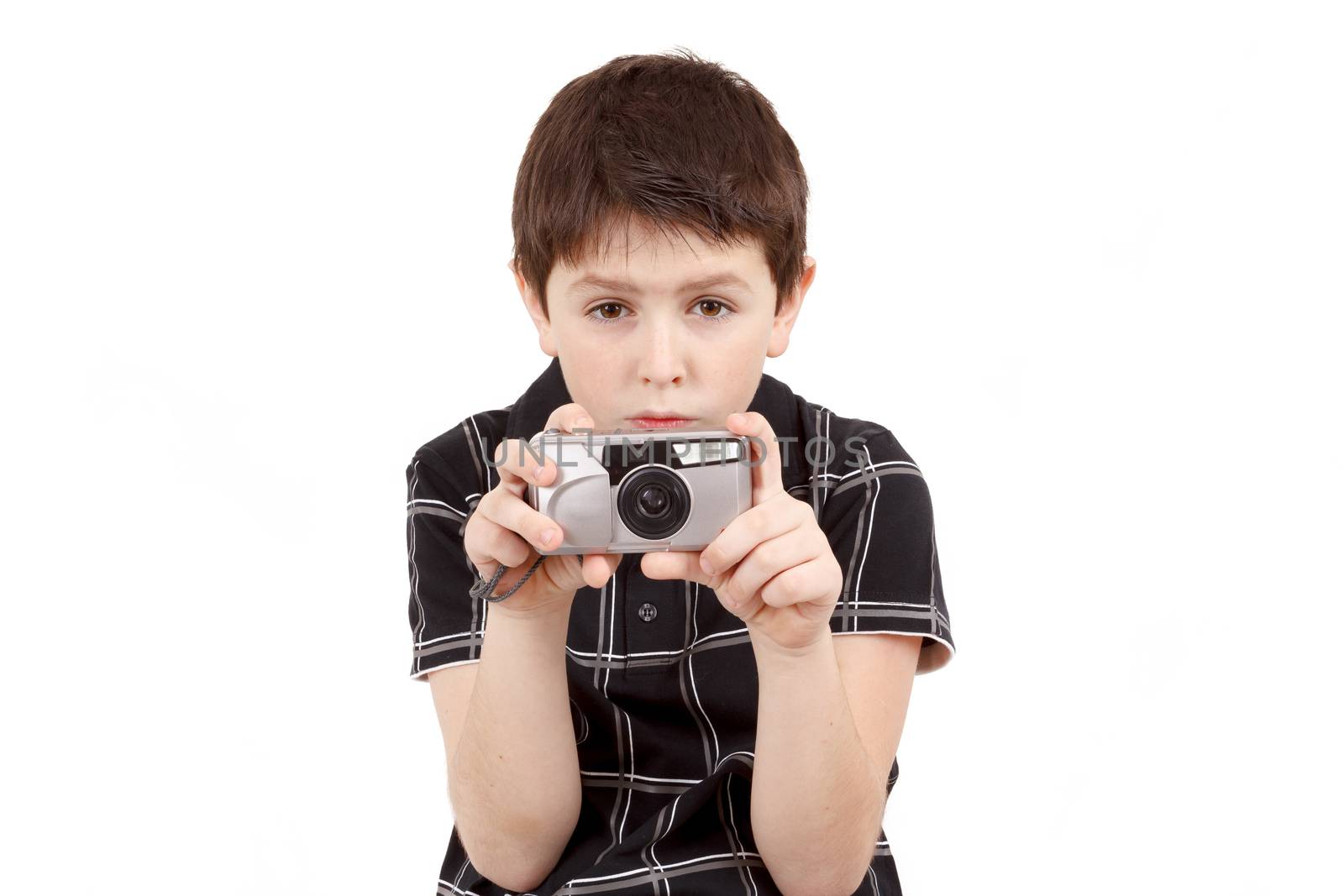 small boy photographing horizontal with digital camera on white background