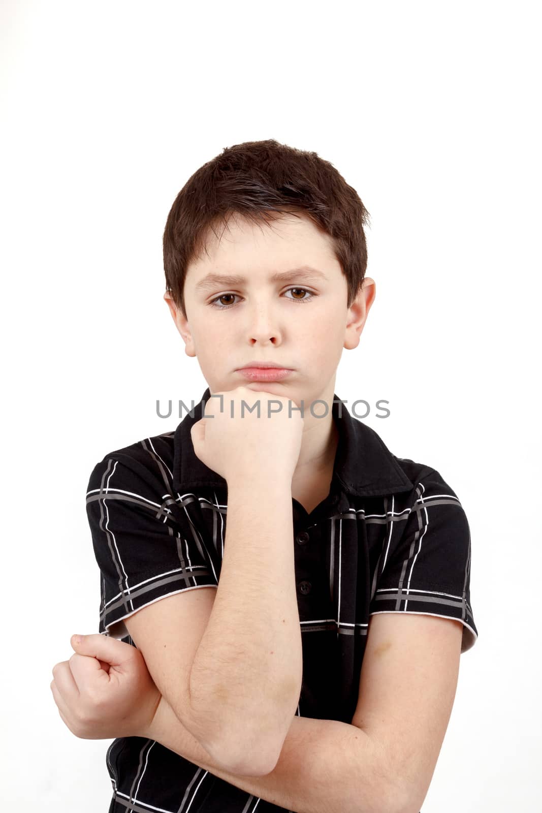pensive young boy with hand on head isolated on white background