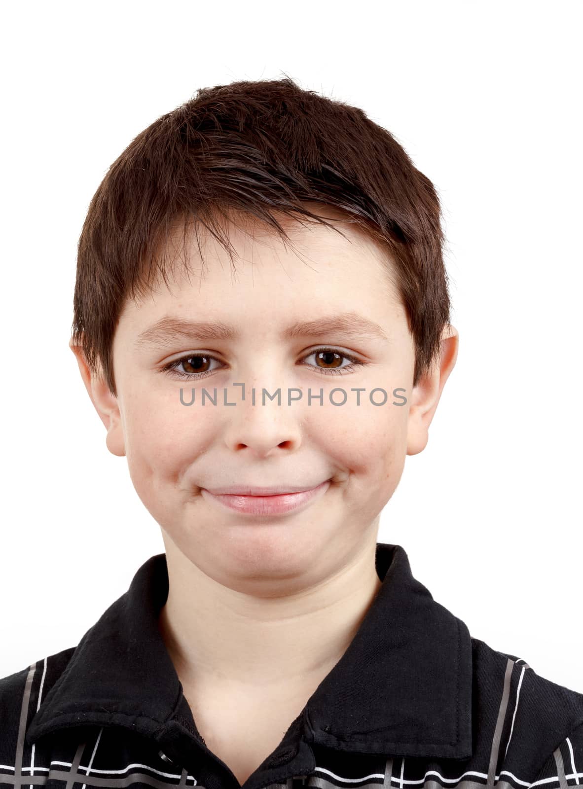 Portrait of a happy smiling young boy against white background 