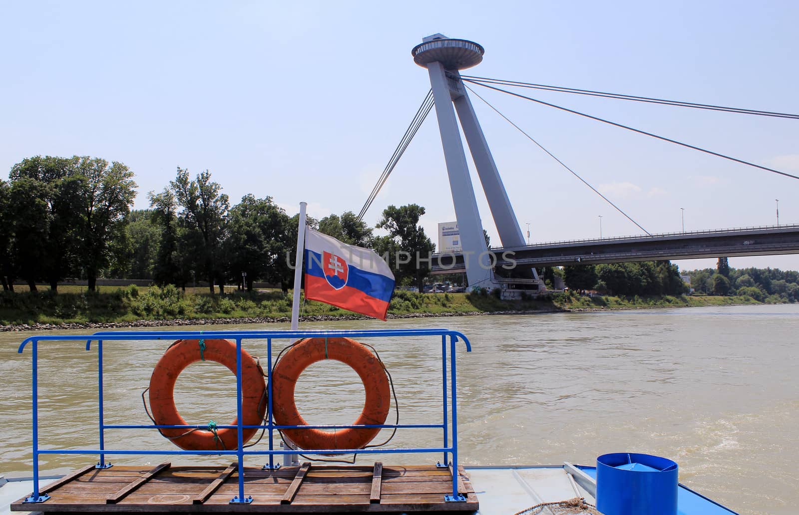 Nov� Most Bridge, view from a boat of  the famous "Ufo" tower, Bratislava. Slovakia (Flag in the foreground)