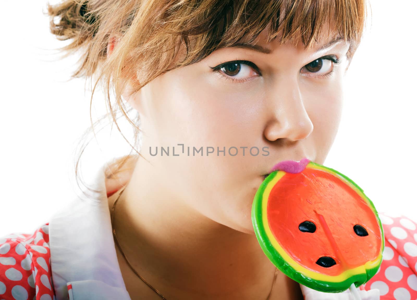 attractive girl with a round lollipop on a white background