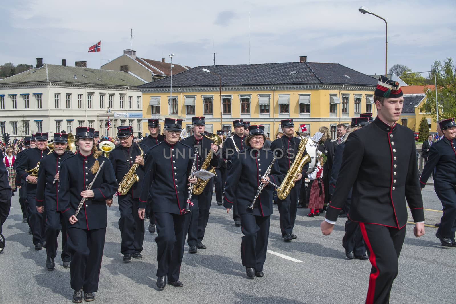 Norwegian Constitution Day is the National Day of Norway and is an official national holiday observed on May 17 each year. This day is also often called the Children's Day. The picture is shot in the center of Halden City.