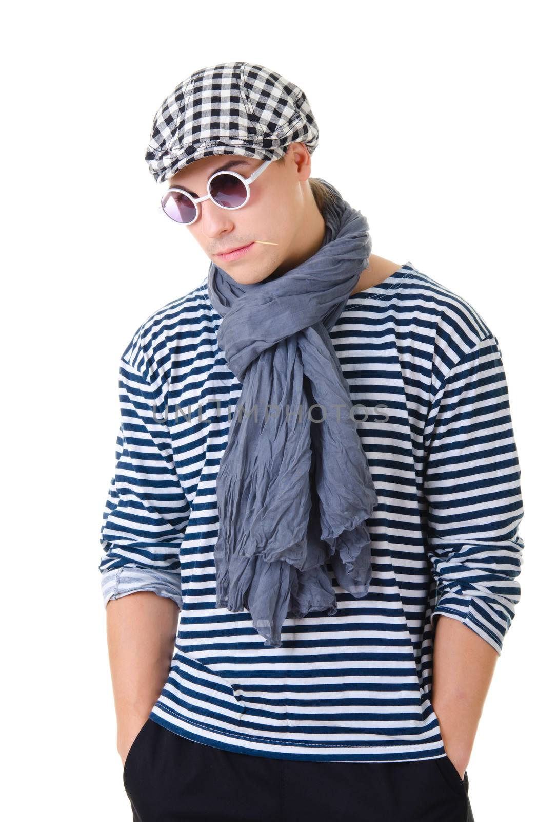 Look naughty handsome young man in stylish striped dress, glasses and cap with suitcase