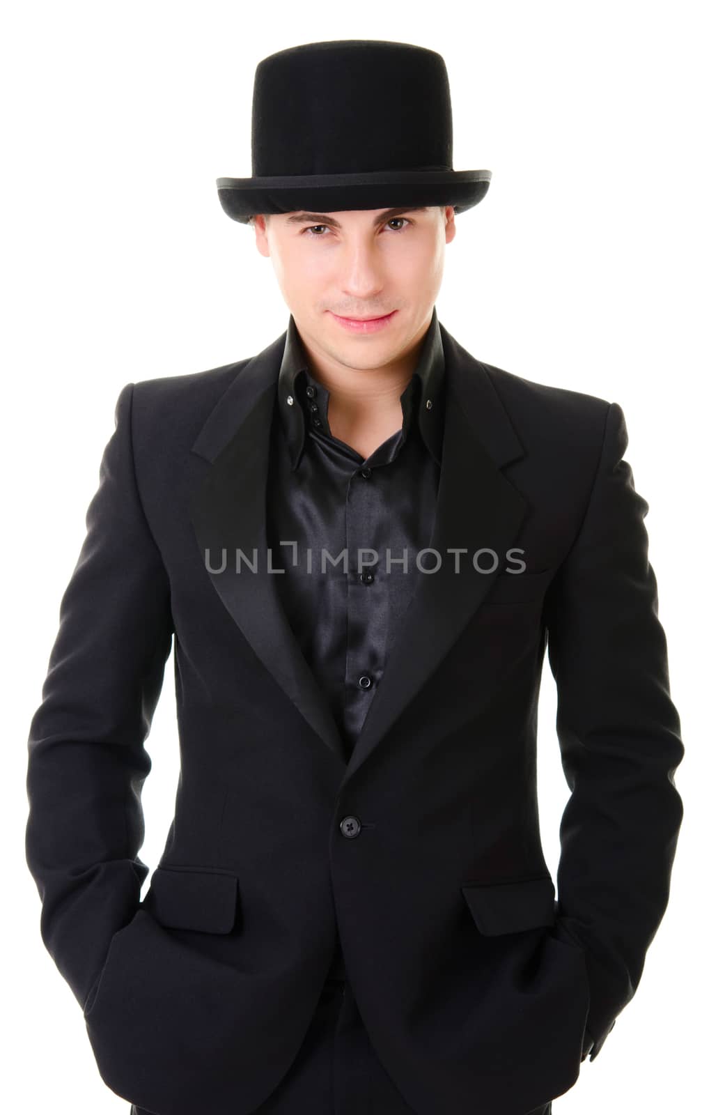 Young attractive man in black suit and hat in austere style isolated on white background