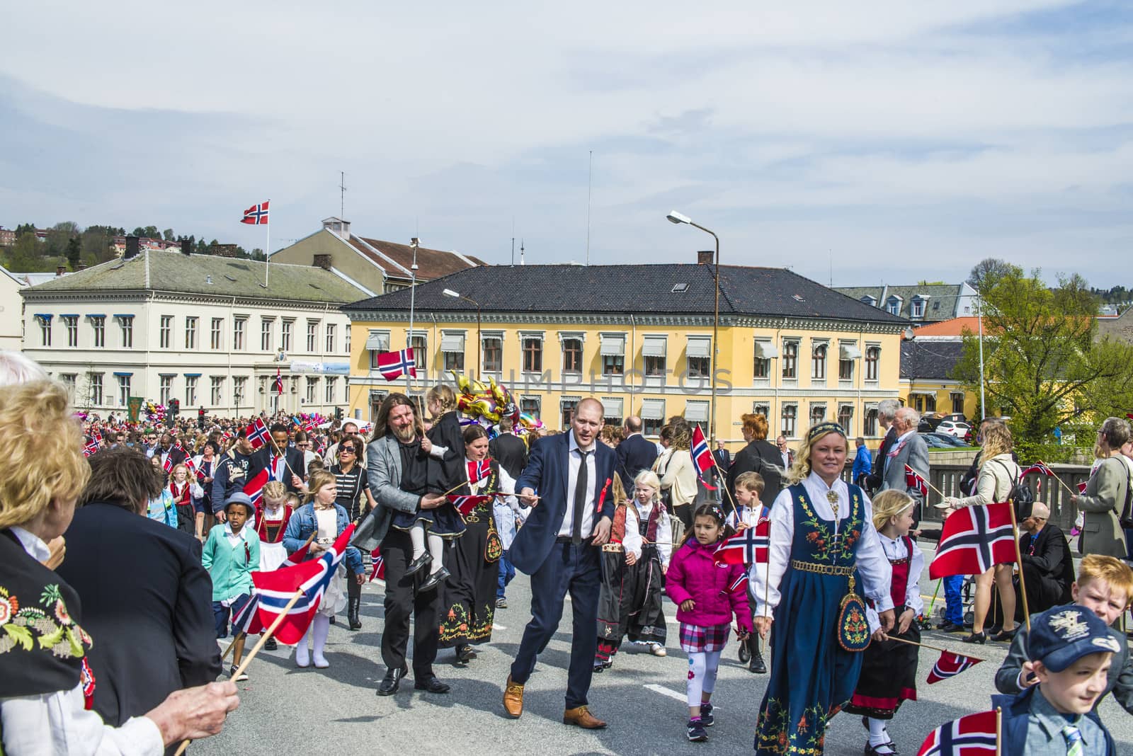Norwegian Constitution Day is the National Day of Norway and is an official national holiday observed on May 17 each year. This day is also often called the Children's Day. The picture is shot in the center of Halden City.
