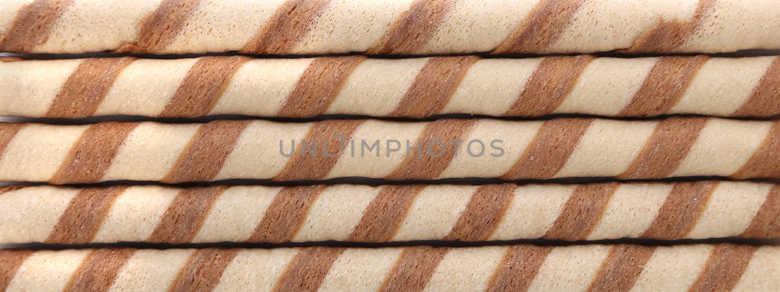 Background of waffle rolls with chocolate cream