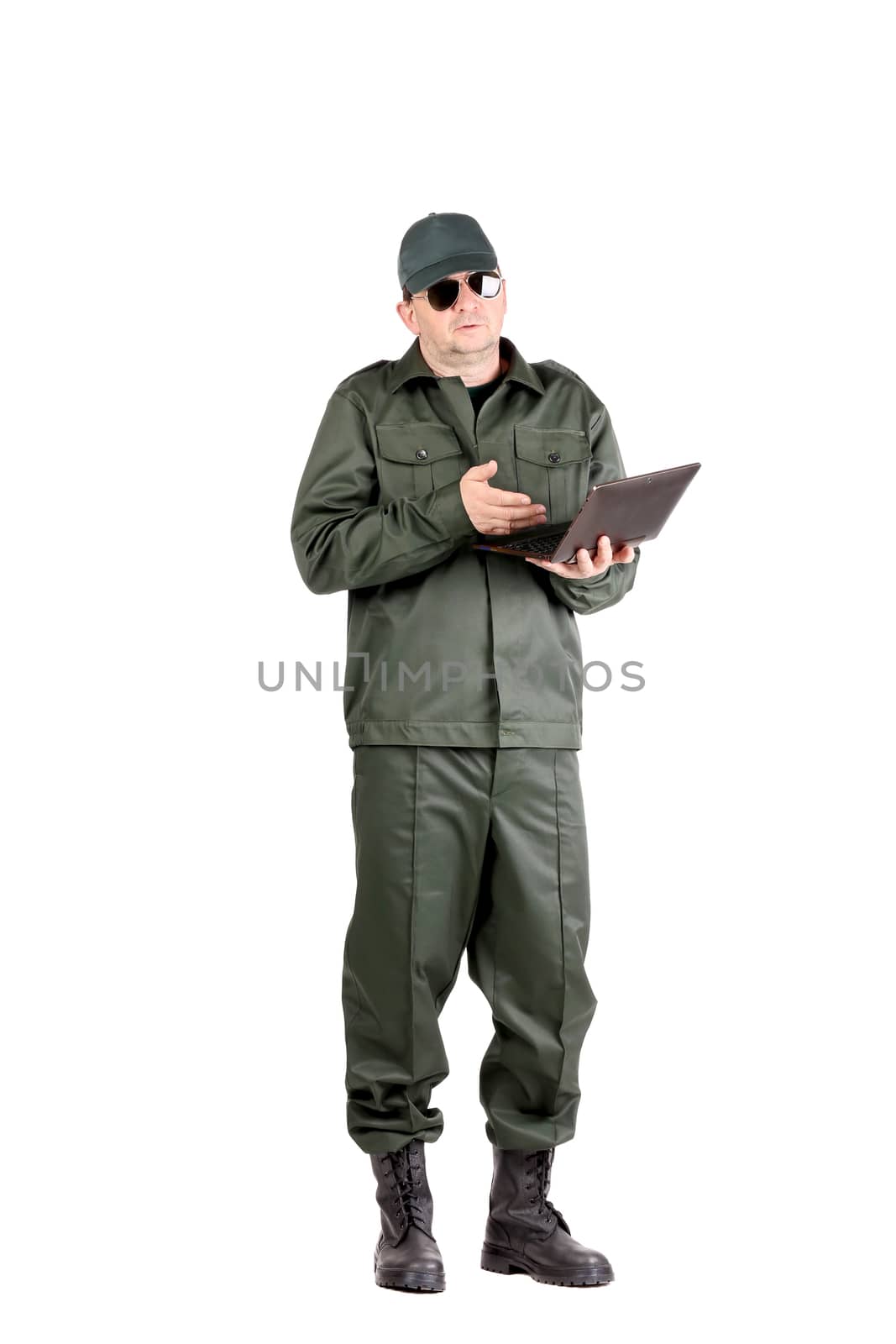 Man in workwear stands with notebook. Isolated on a white background.