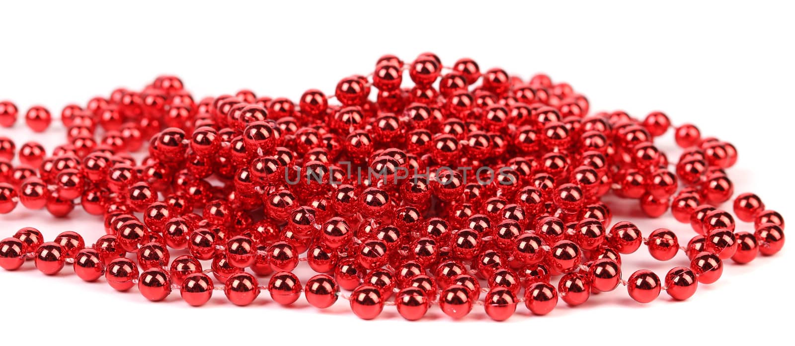 Christmas garland of small red beads. Isolated on white background.