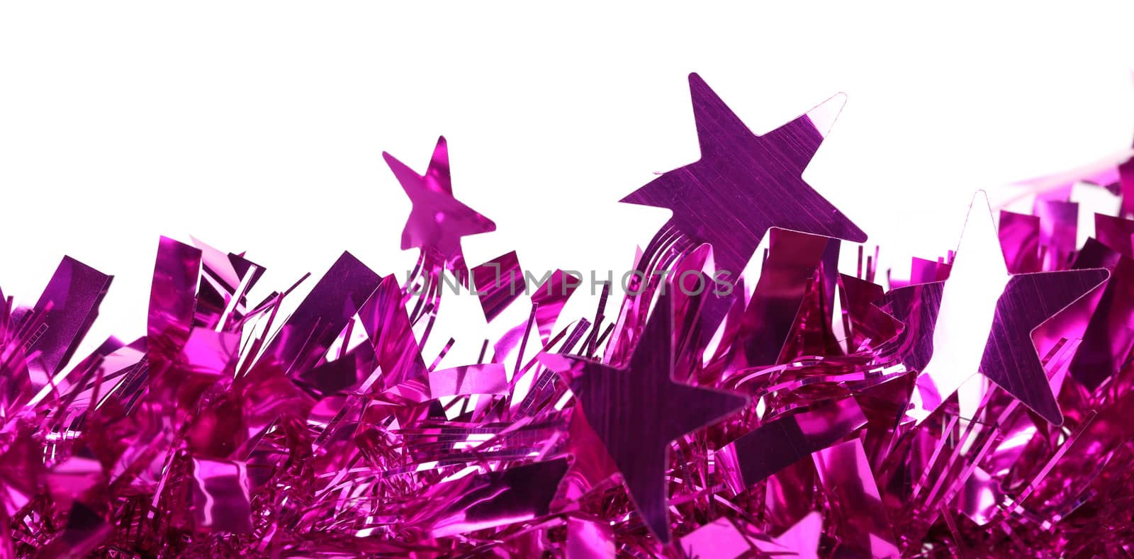 Closeup of christmas purple tinsel with stars. Isolated on a white.