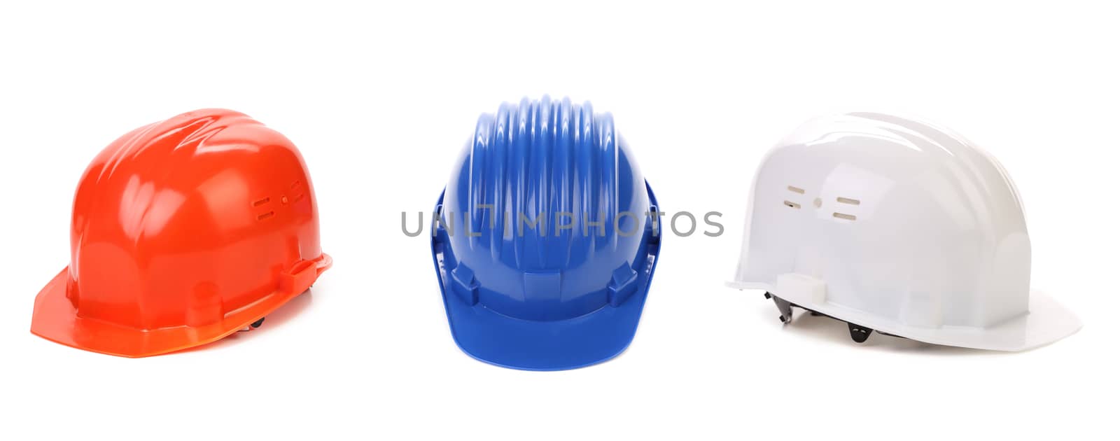 White red and blue hard hats isolated on white