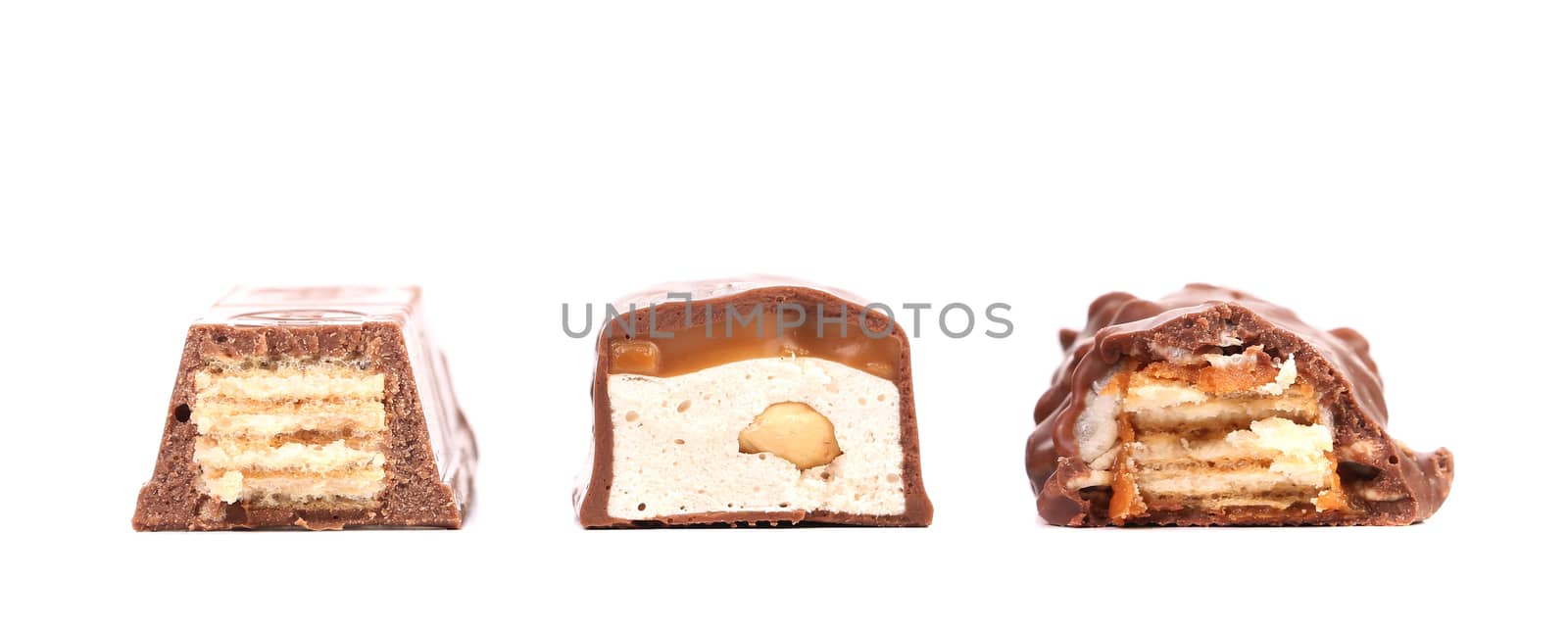 Different slices bar of chocolate. Close up. Isolated. On a white background