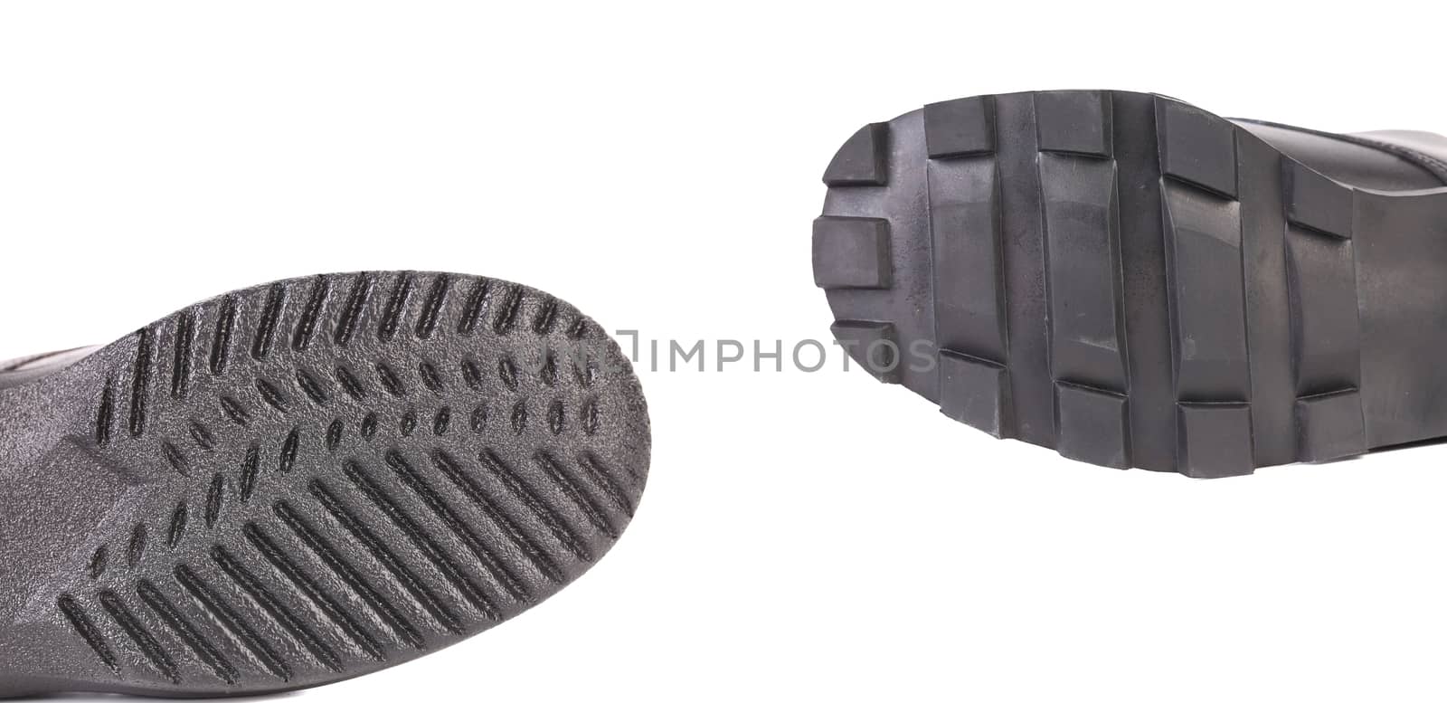 Two black shoe soles. by indigolotos