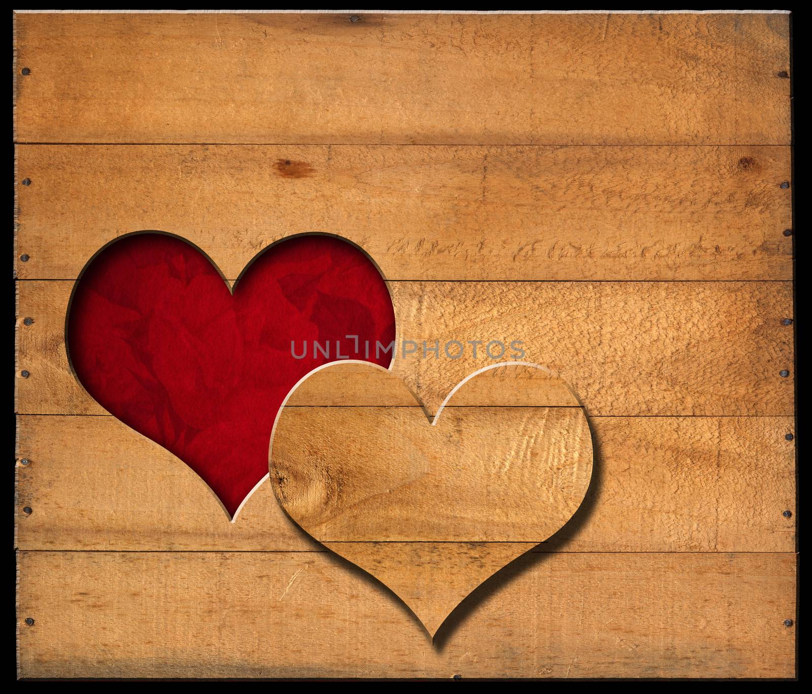 Brown wooden wall with a hole in the shape of heart and red velvet background with roses flowers