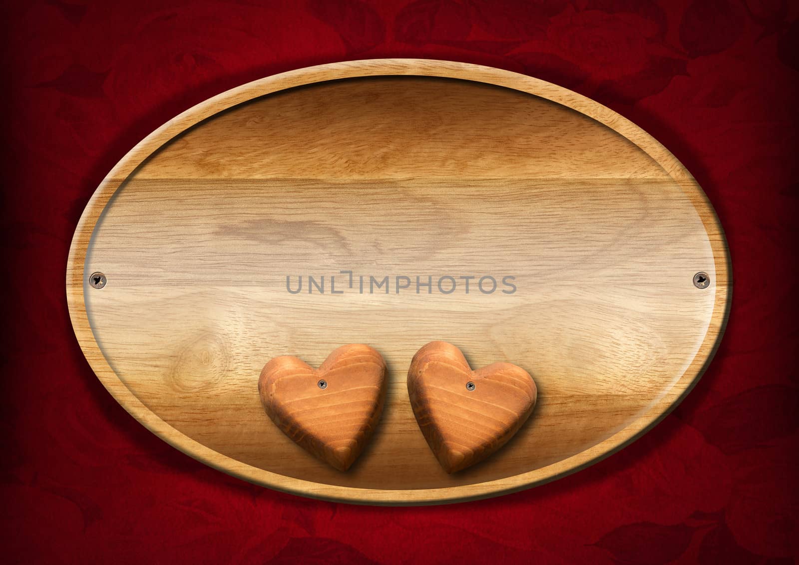 Wooden plate with two wooden hearts on red velvet background with roses flowers
