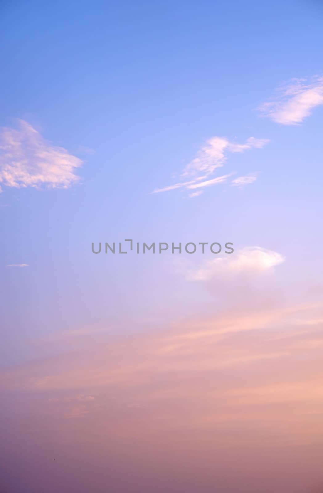 sunlight rays and clouds on the blue sky background