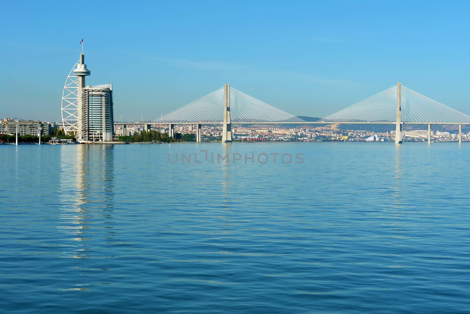 View from river Tagus of Lisbon's Nations park and "Vasco da Gama" Bridge, Portugal                           