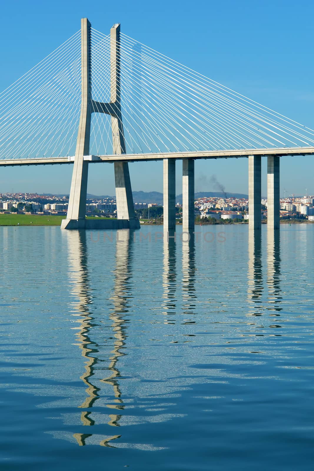 View from river Tagus of Lisbon's Nations park and "Vasco da Gama" Bridge, Portugal                           