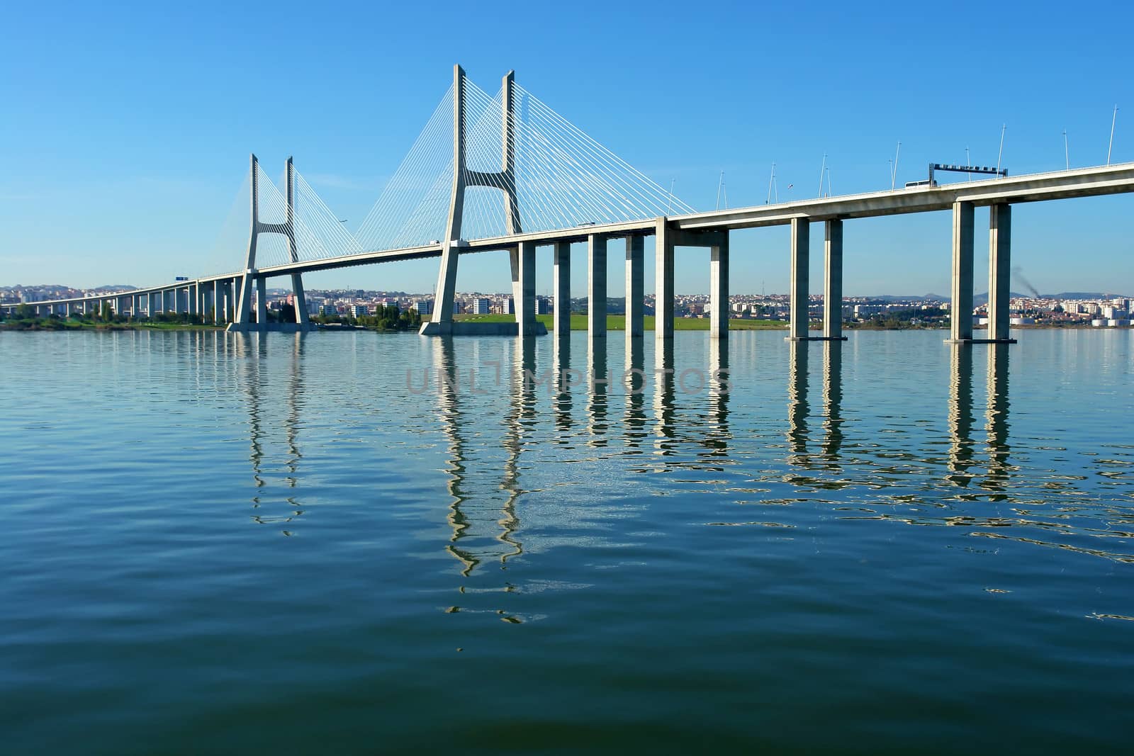 View from river Tagus of Lisbon's "Vasco da Gama" Bridge, Portugal                           