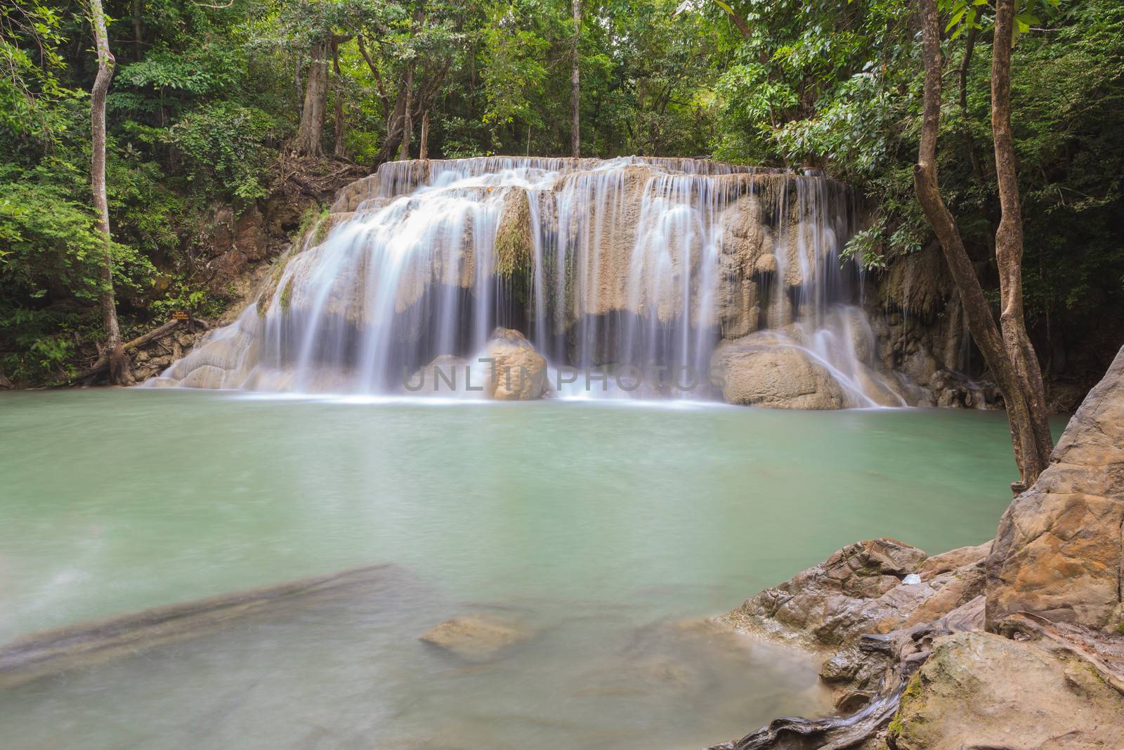 Waterfall in tropical forest at Erawan national park Kanchanabur by panyajampatong