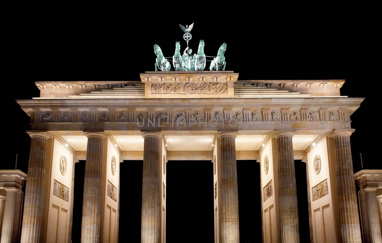 Brandenburg Gate at night, a former city gate and one of the main symbols of Berlin, Germany