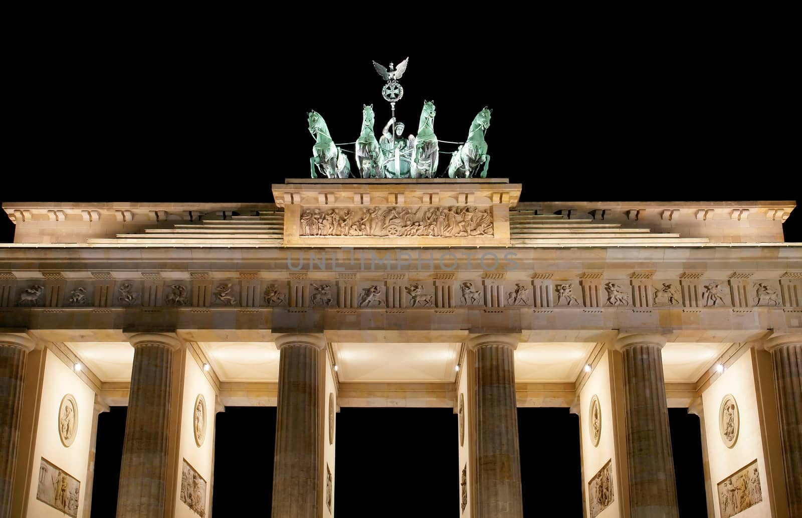 Brandenburg Gate at night, a former city gate and one of the main symbols of Berlin, Germany