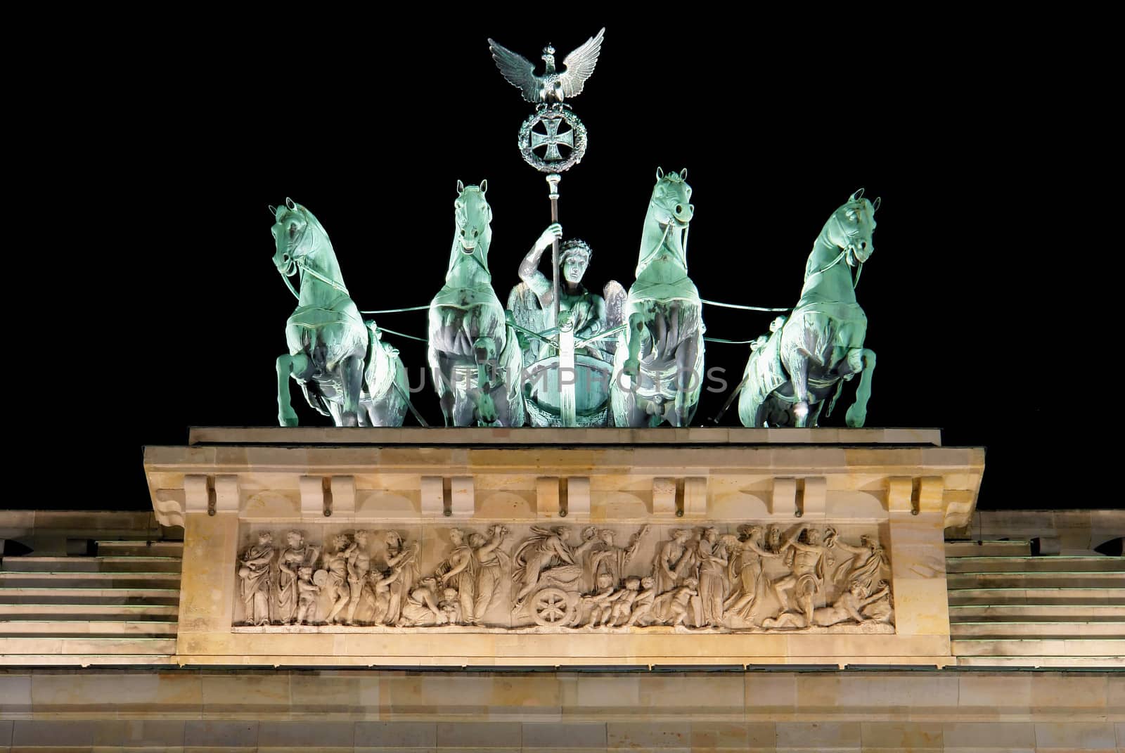 Brandenburg Gate detail at night, a former city gate and one of the main symbols of Berlin, Germany