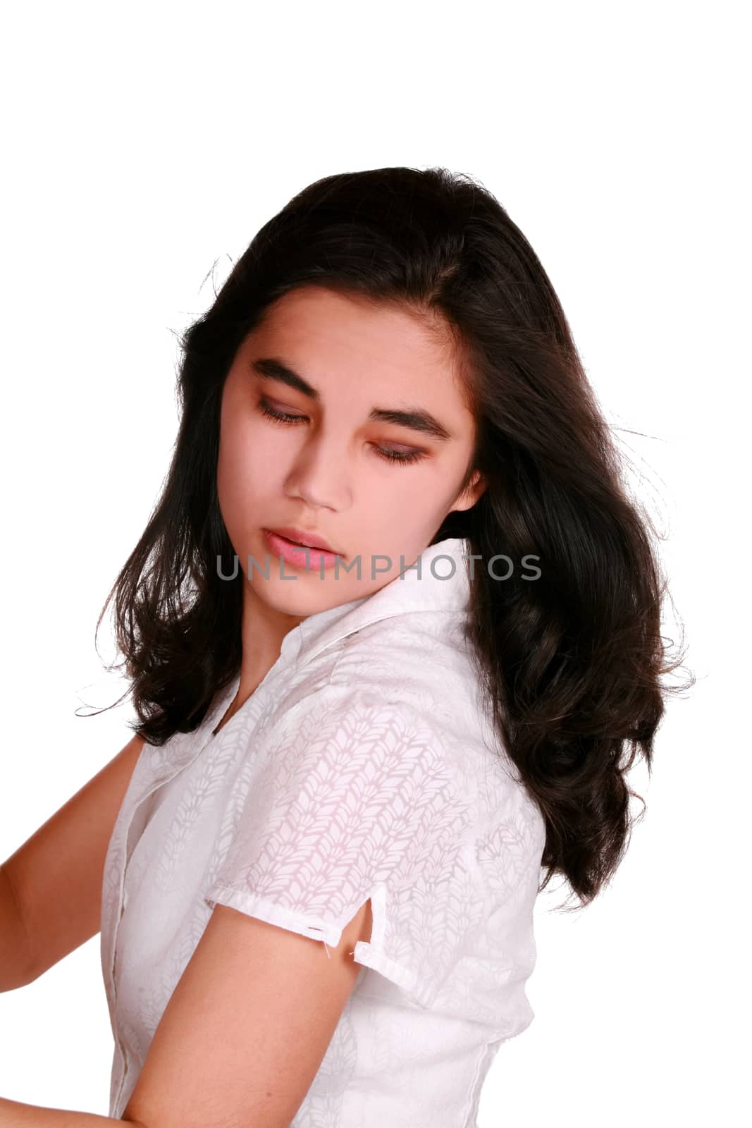 Beautiful biracial teen girl eyes closed looking over shoulder