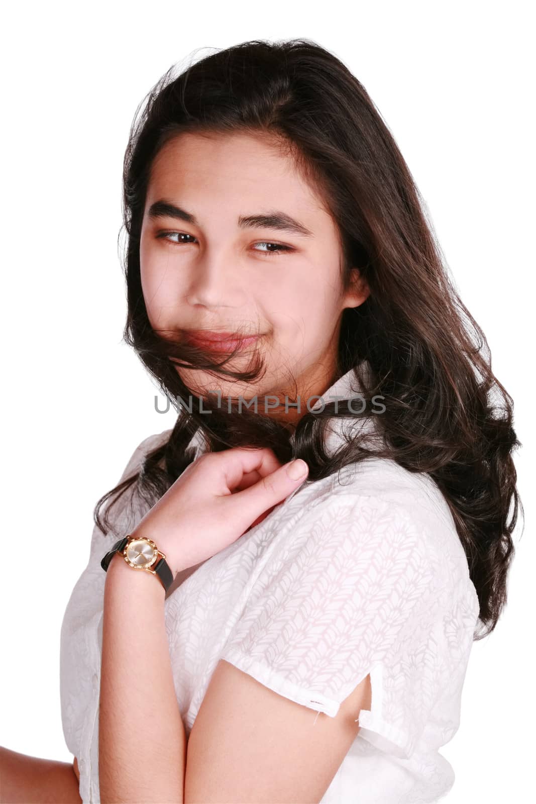 Beautiful biracial teen girl in casual pose, looking over shoulder