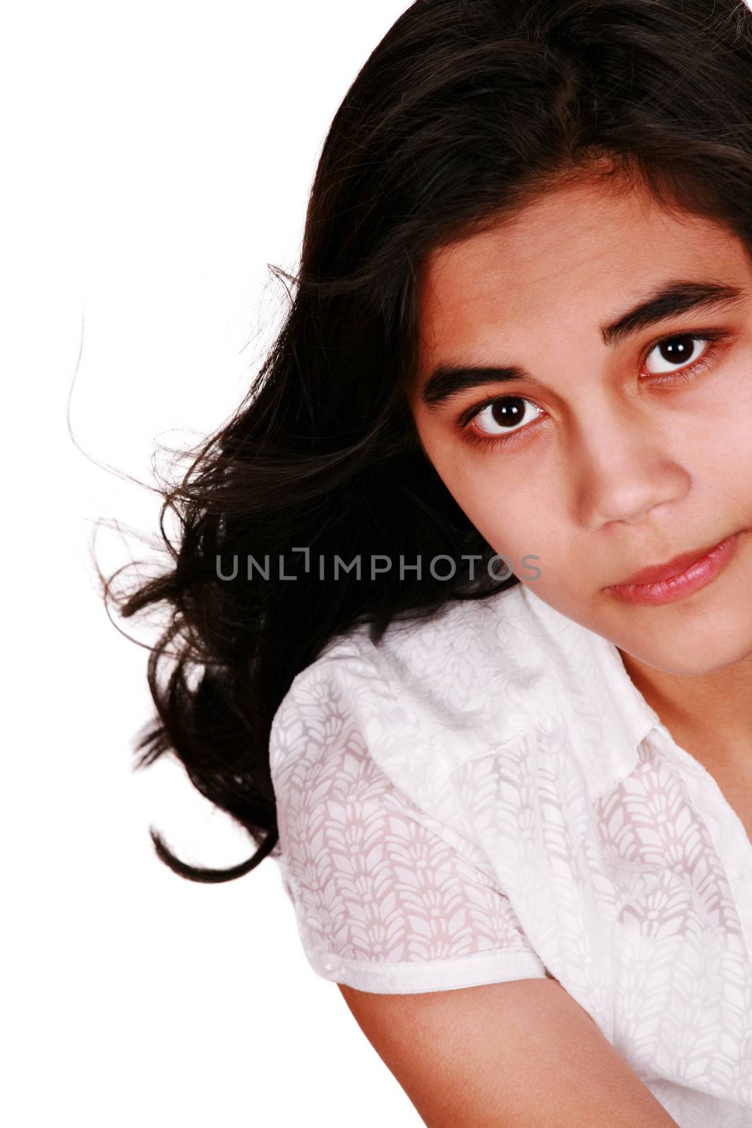 Beautiful biracial teen looking up with sad expression by jarenwicklund