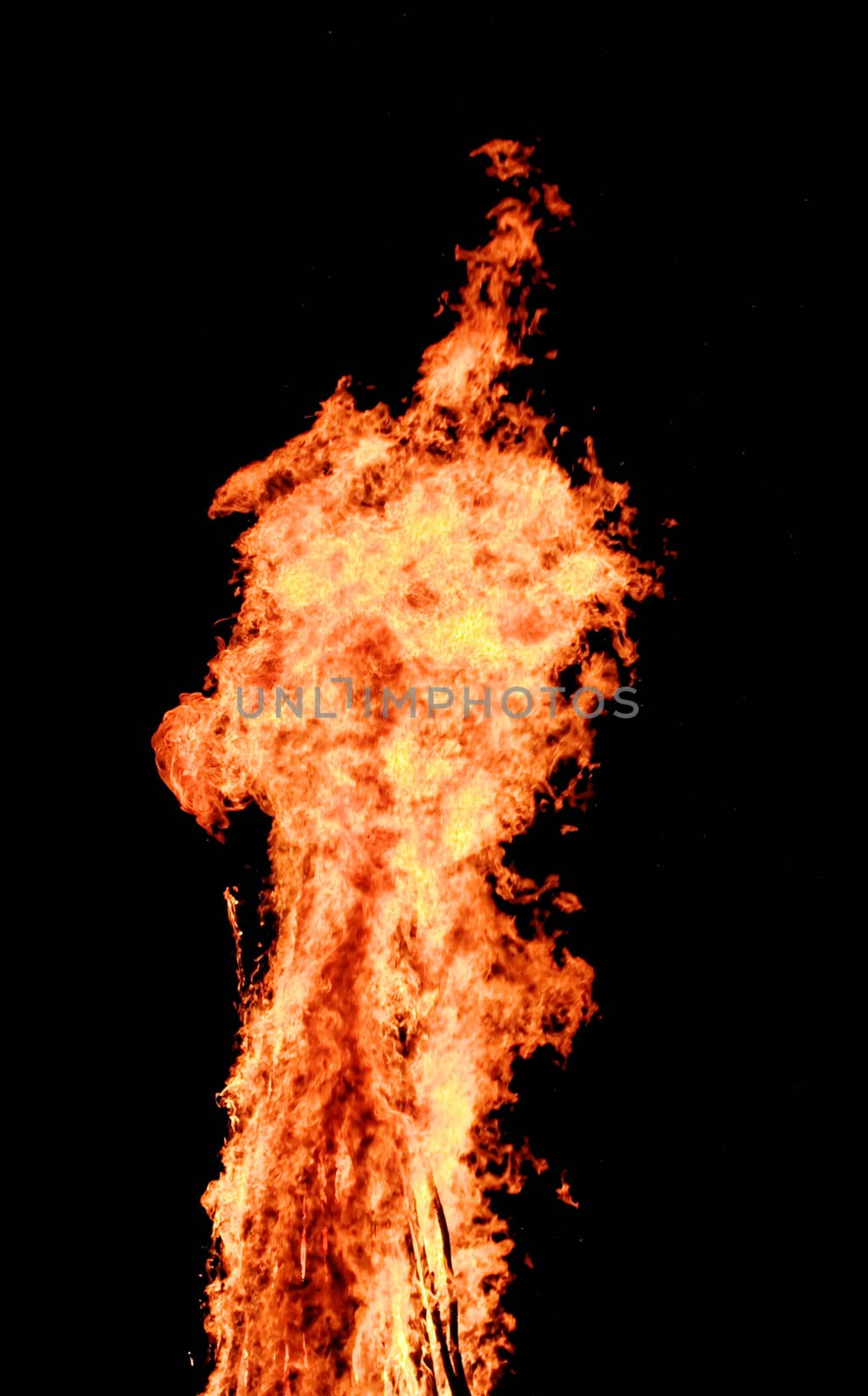 red flames of huge bonfire or campfire as black backgorund