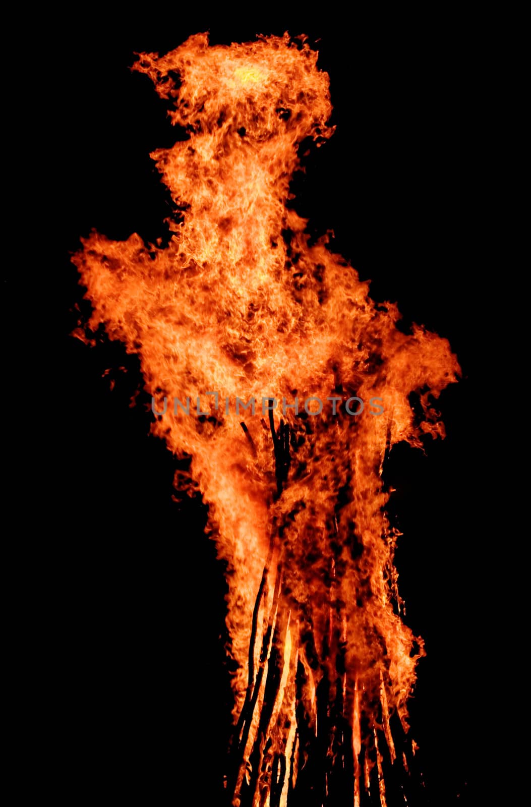 red flames of huge bonfire or campfire as black backgorund