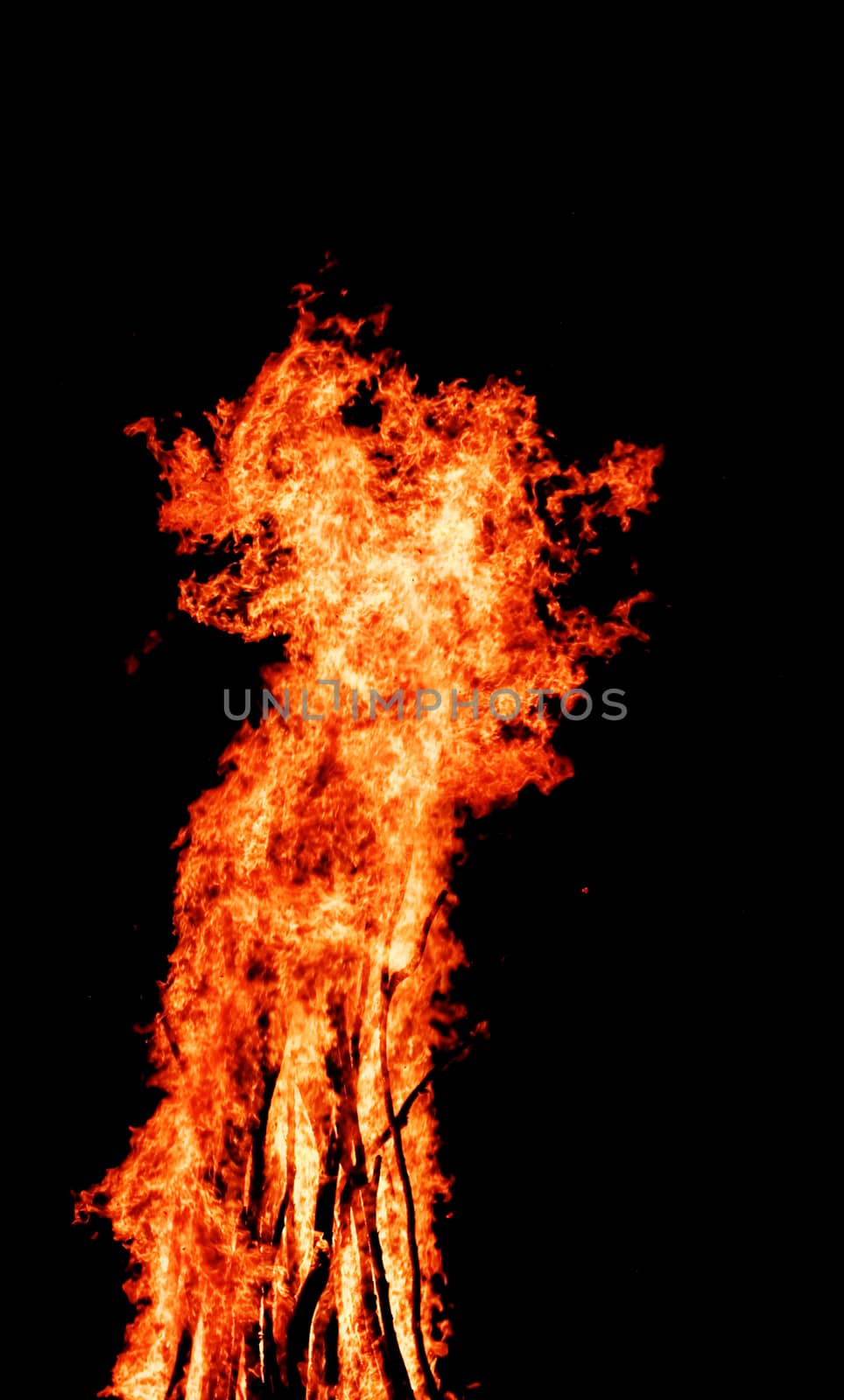 red flames of huge bonfire or campfire as black backgorund