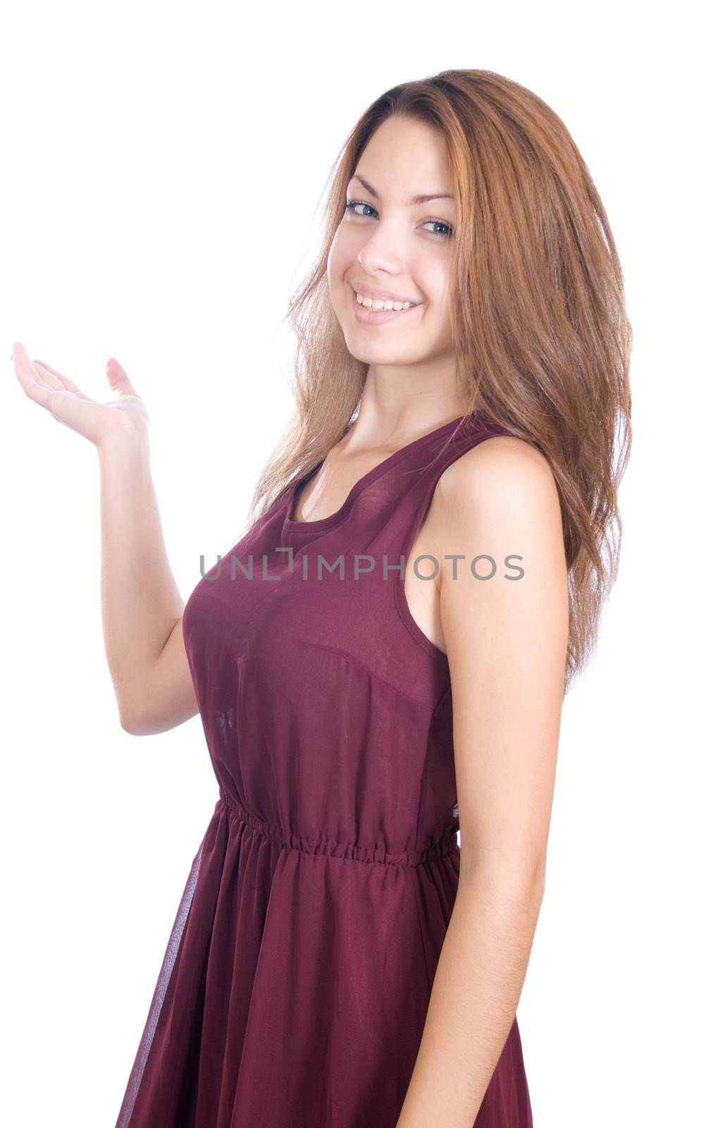Smiling woman points a hand isolated on white background